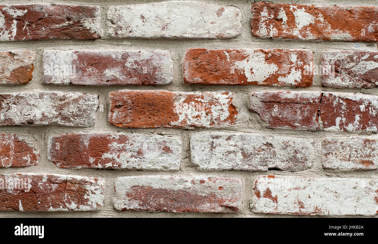 Red brick wall painted white. texture, background, design Stock Photo