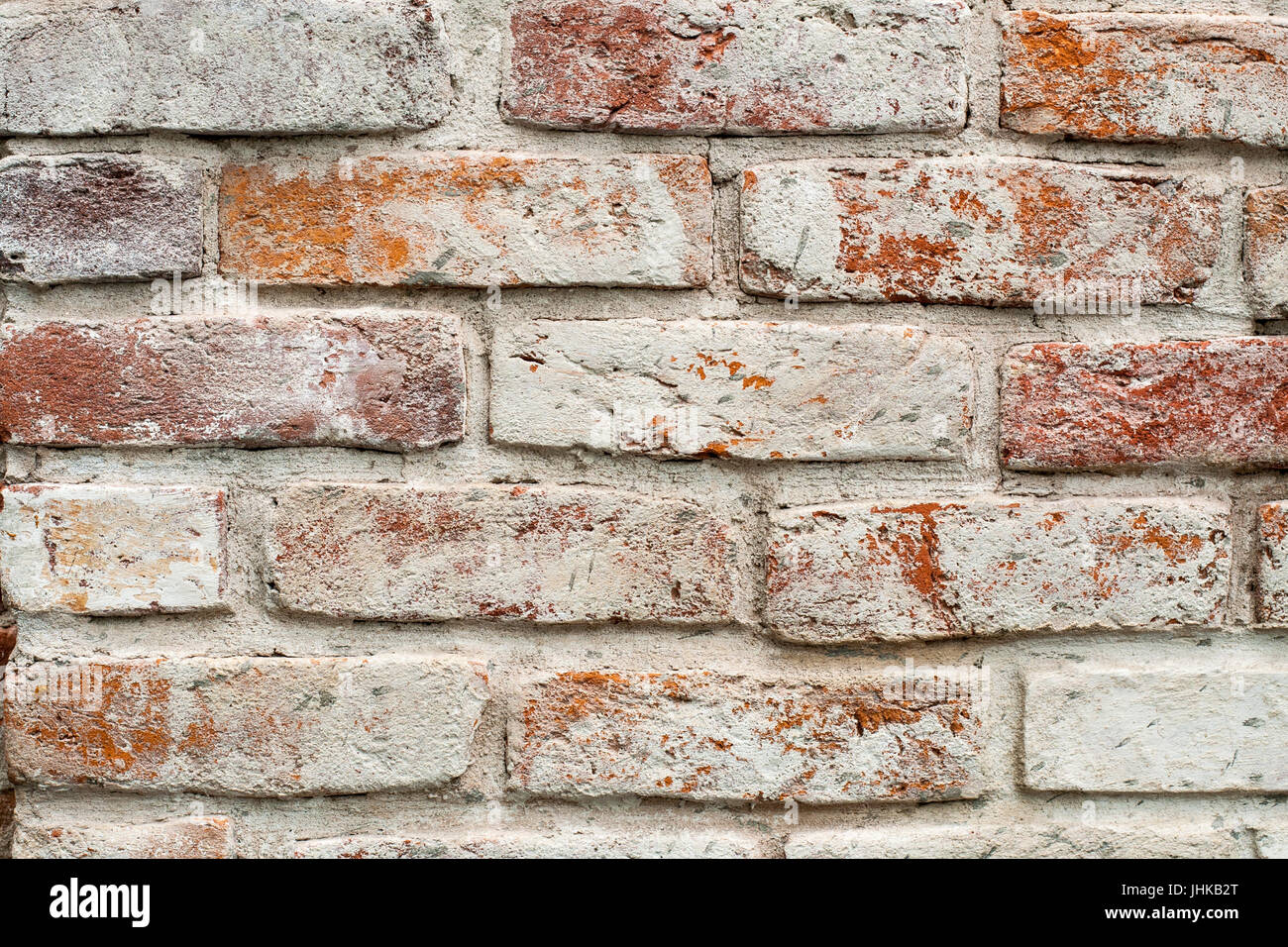 Red brick wall painted white. texture, background, design Stock Photo