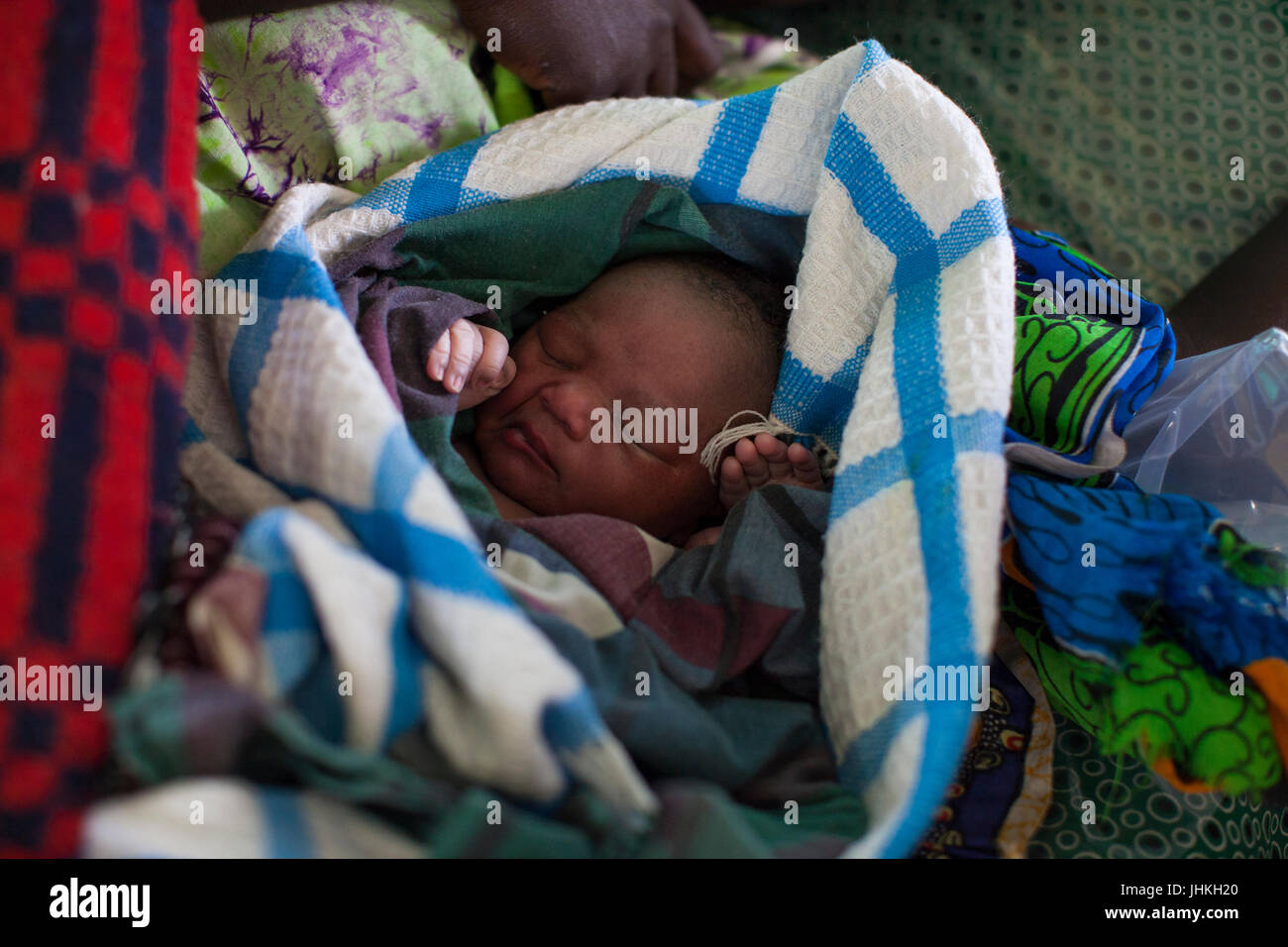 A new born baby swaddled in blankets, Uganda Stock Photo Alamy