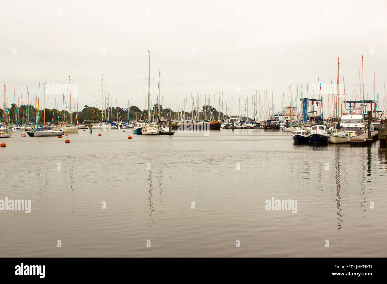 The crammed marina at Lymington Harbour home to the Royal Lymington Yacht Club. Taken on a dull grey summer's day in June Stock Photo