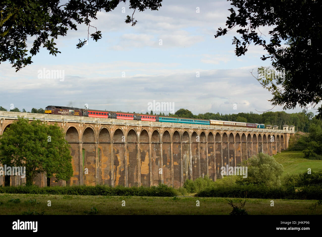 A pair of class 47 diesel locomotives working a West Coast Railways charter crossing the Ouse Valley Viaduct near Balcombe in West Sussex.  47826 and  Stock Photo