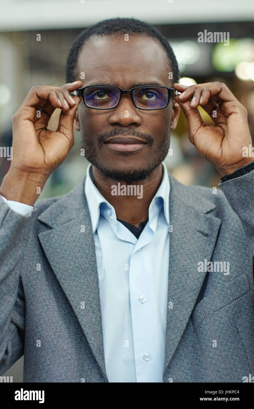Portrait of handsome afro american man with short hair wearing glasses  Stock Photo - Alamy