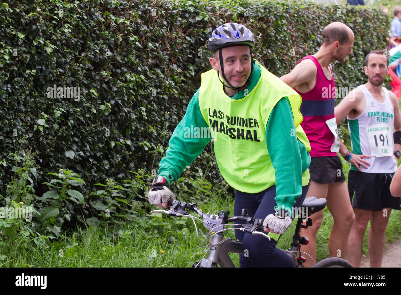 Cyclists at road running race Stock Photo Alamy