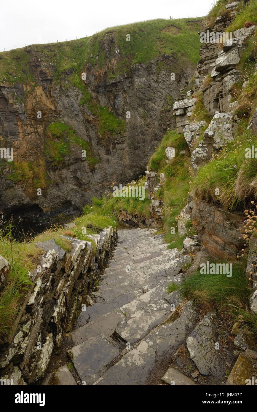 The 'Whaligoe steps' lead down to a natural fishing harbour surrounded by cliffs in Ulbster,  Scotland which was used by fishermen in the 1700's Stock Photo
