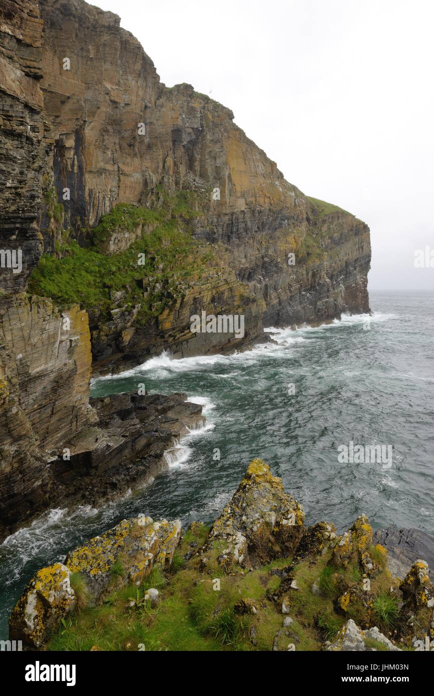 The 'Whaligoe steps' lead down to a natural fishing harbour surrounded by cliffs in Ulbster,  Scotland which was used by fishermen in the 1700's Stock Photo