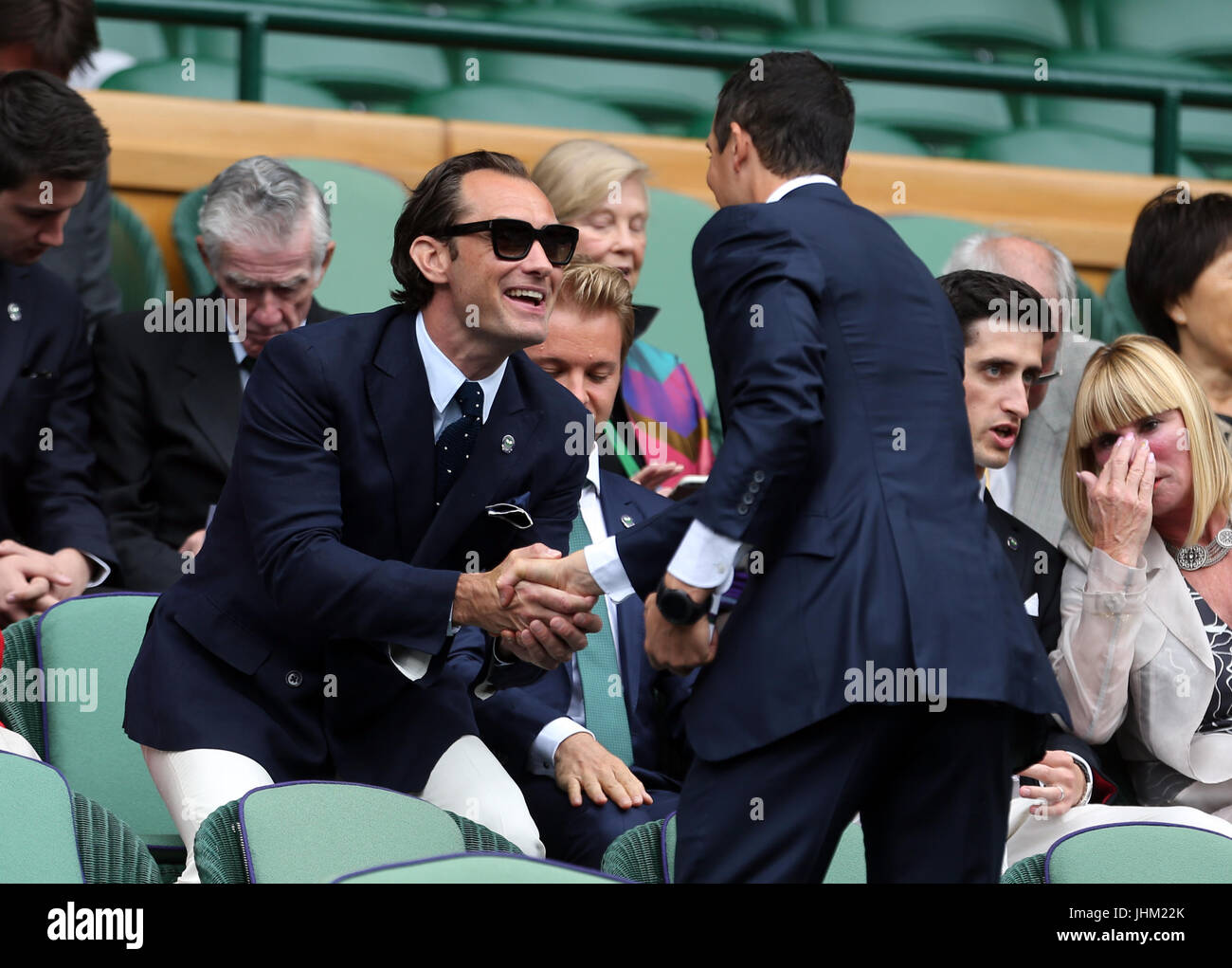 Jude Law and Bear Grylls on day eleven of the Wimbledon Championships at  The All England Lawn Tennis and Croquet Club, Wimbledon Stock Photo - Alamy