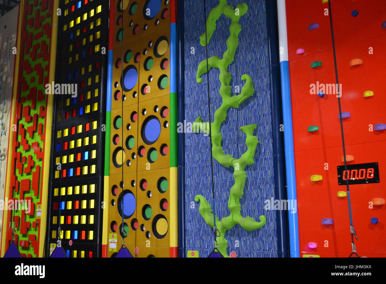 Indoor all weather climbing wall re children kids exercise climb activity adventure Stock Photo