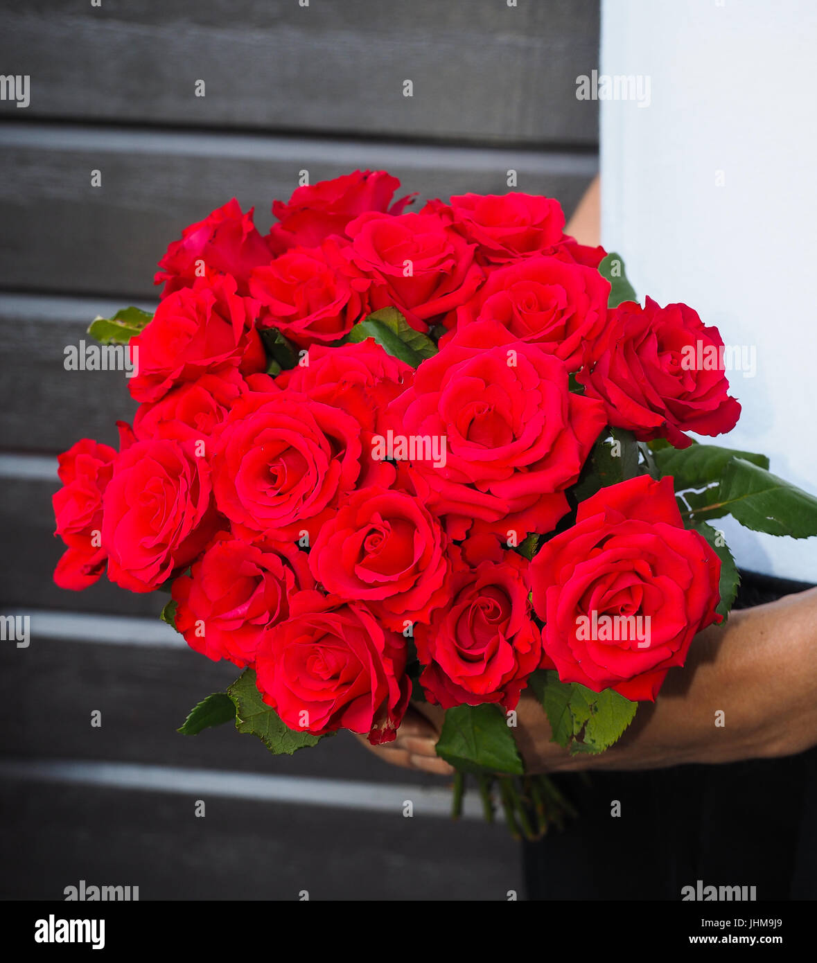 Male person holding a beautiful bouquet 
