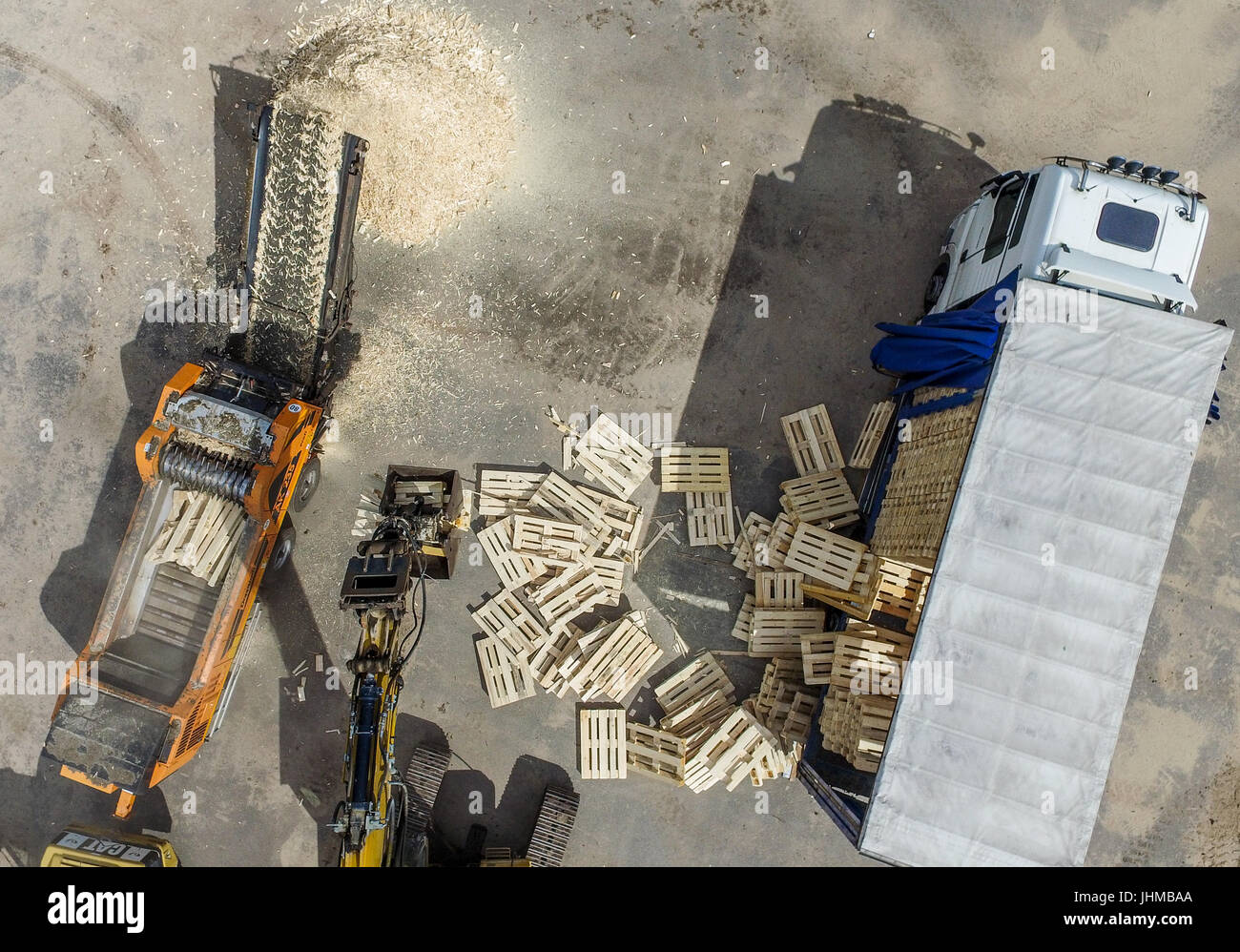 Counterfeit euro-pallets being destroyed in the yard of a recycling ...