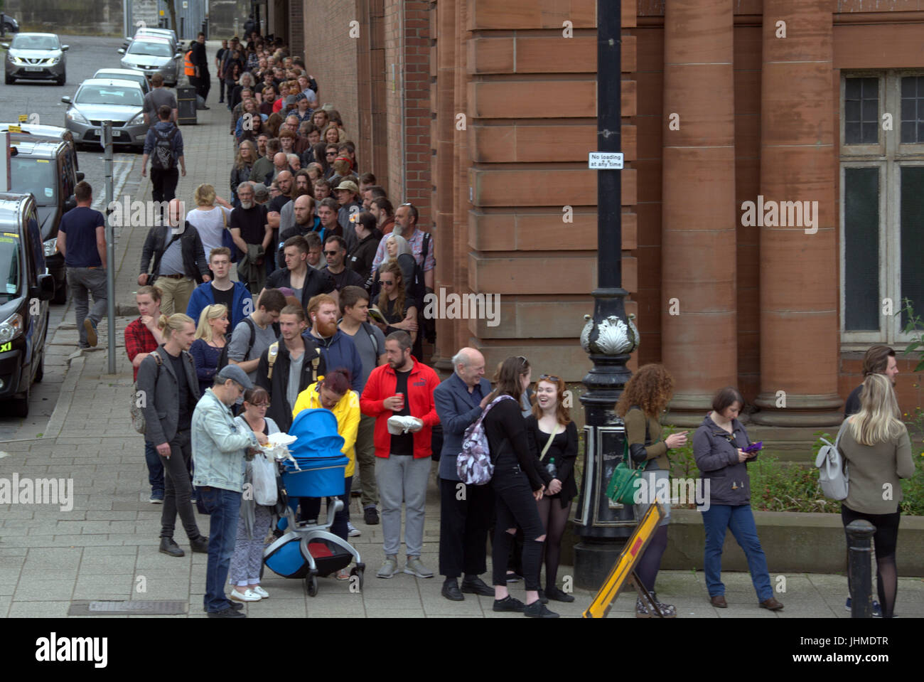 Glasgow, Scotland, UK. 14th July. Long queues in Glasgow for a film as casting for extras rakes place at the city's Kelvin Hall. The movie based on Robert the Bruce gave preference for beards though both men and women were required. The length of the queie caused a stir locally and one musician decided to come back tomorrow on his bike for the second day of casting hoping it had gone down by then. Credit Gerard Ferry/Alamy news Stock Photo