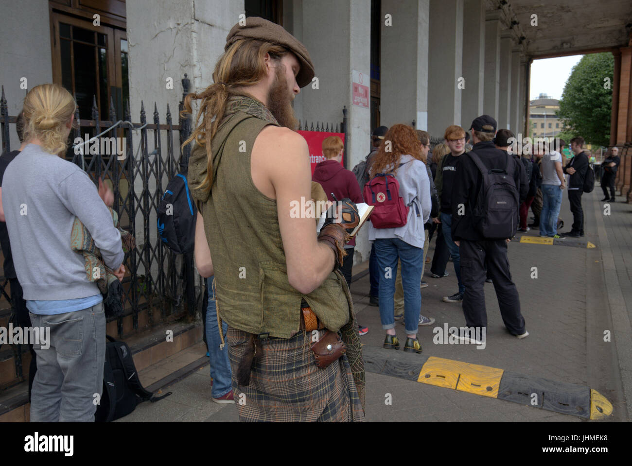 Glasgow, Scotland, UK. 14th July. Long queues in Glasgow for a film as casting for extras rakes place at the city's Kelvin Hall. The movie based on Robert the Bruce gave preference for beards though both men and women were required. The length of the queie caused a stir locally and one musician decided to come back tomorrow on his bike for the second day of casting hoping it had gone down by then. Credit Gerard Ferry/Alamy news Stock Photo