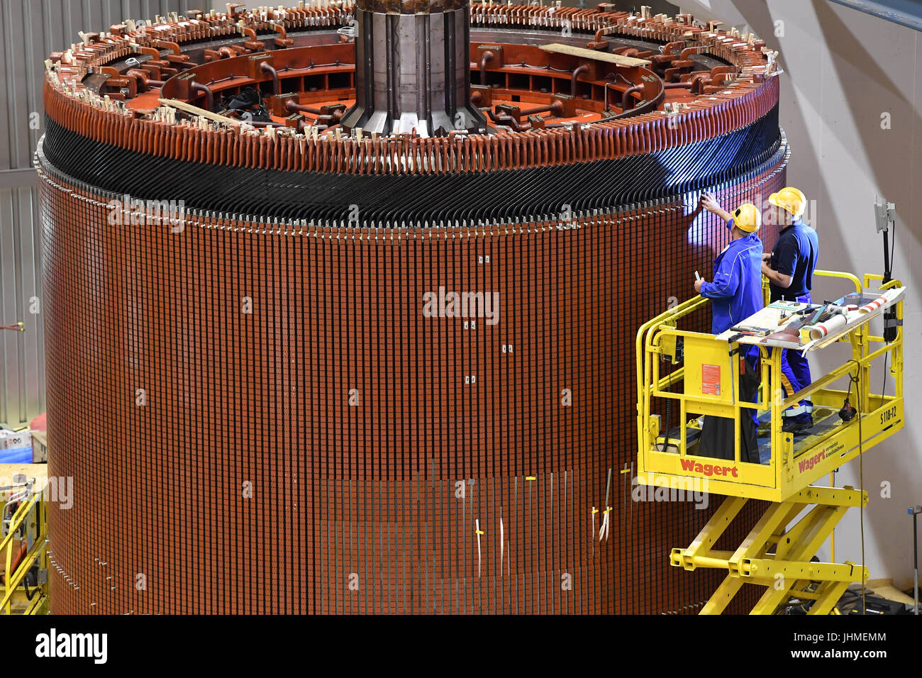 The generator rotor of an asynchronous motor generator is checked at ...