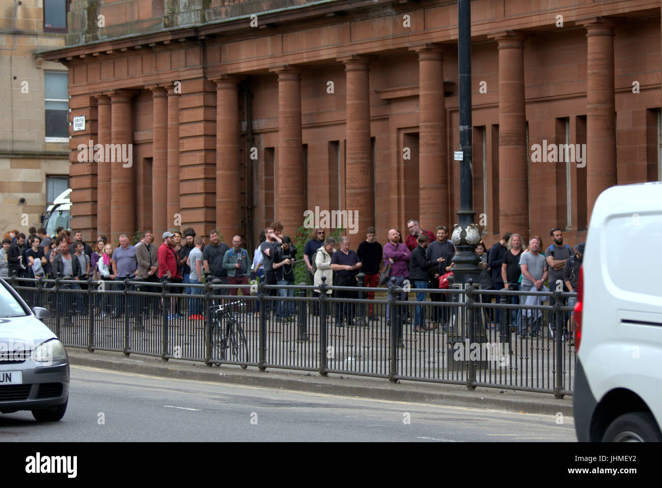 Glasgow, Scotland, UK. 14th July. Long queues in Glasgow for a film as casting for extras rakes place at the city's Kelvin Hall. The movie based on Robert the Bruce gave preference for beards though both men and women were required. The length of the queie caused a stir locally and one musician decided to come back tomorrow on his bike for the second day of casting hoping it had gone down by then. Credit Gerard Ferry/Alamy news Stock Photo