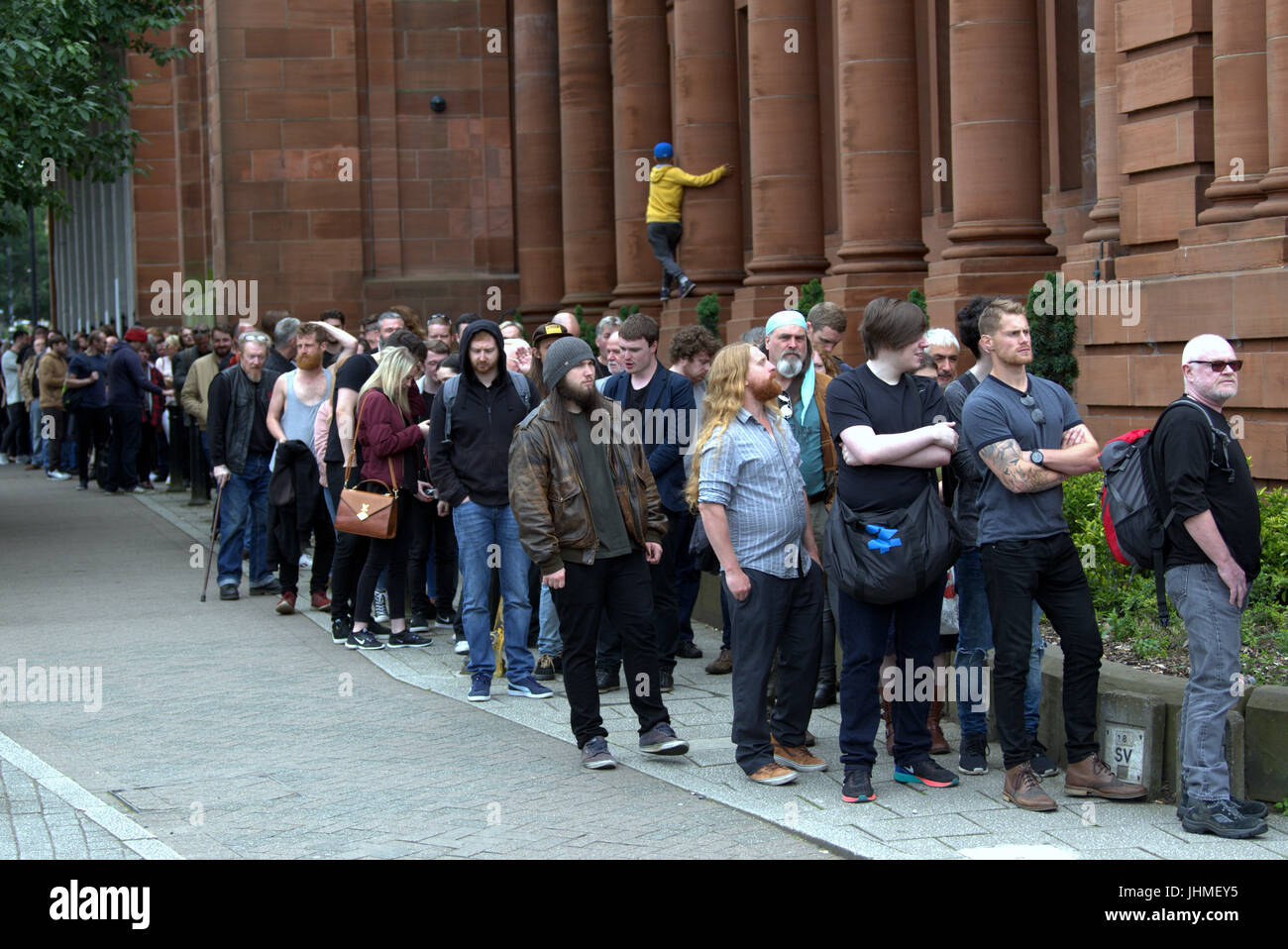 Glasgow, Scotland, UK. 14th July. Long queues in Glasgow for a film as casting for extras rakes place at the city's Kelvin Hall. The movie based on Robert the Bruce gave preference for beards though both men and women were required. The length of the queie caused a stir locally and one musician decided to come back tomorrow on his bike for the second day of casting hoping it had gone down by then. Credit Gerard Ferry/Alamy news Stock Photo