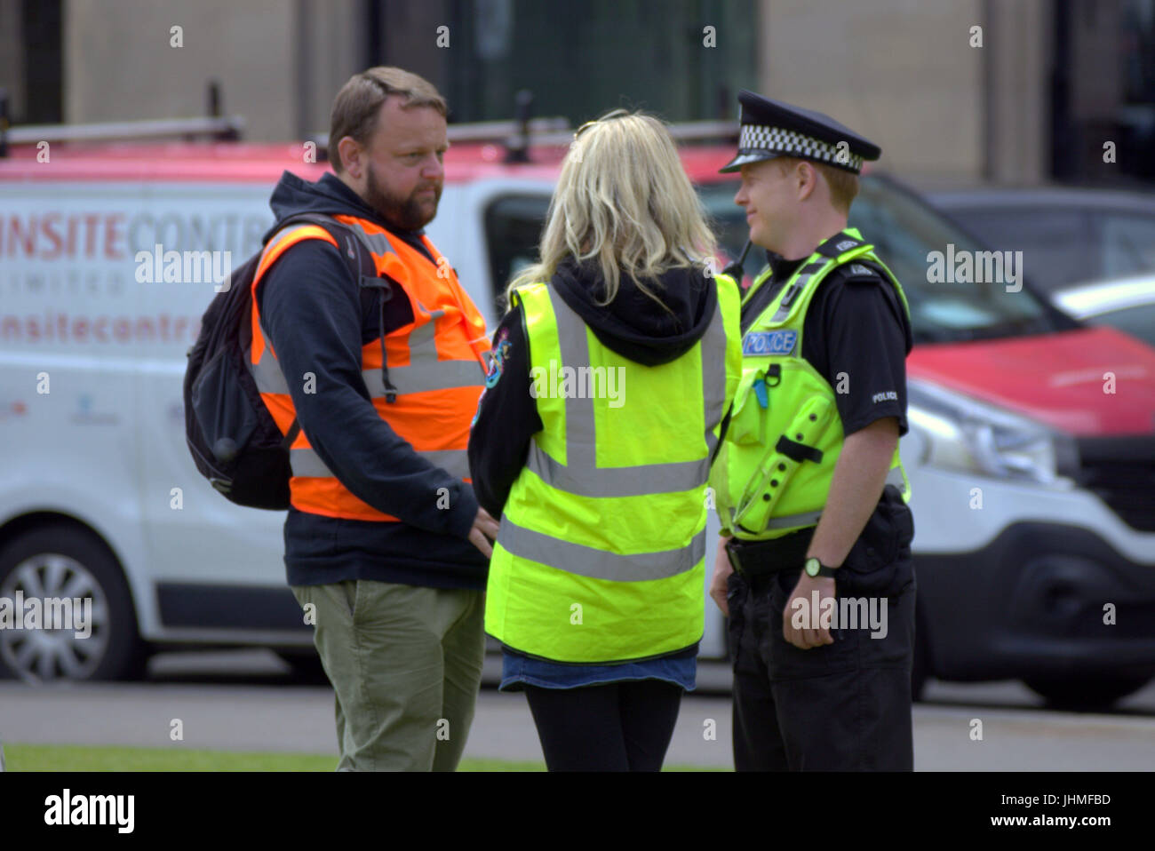 Glasgow, Scotland, UK. 14th July. Filming was nonchalantly ignored today by locals now getting used to media and film crews in the city as people passed their lunchtime with the latest series of  the BBC Scotland spoof police comedy “Scot squad” was being shot in the city's George Square, Credit: gerard ferry/Alamy Live News Stock Photo