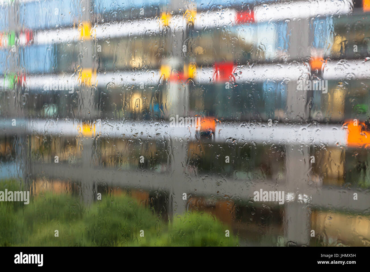 Drops of rain on office window Stock Photo