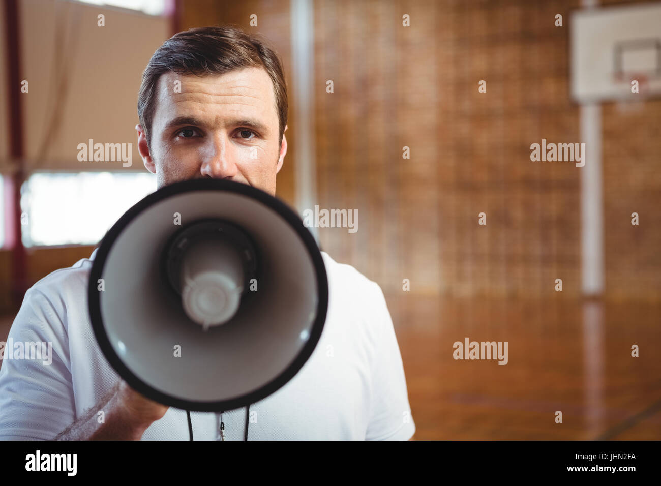 Close up portrait of male coach using megaphone Stock Photo Alamy