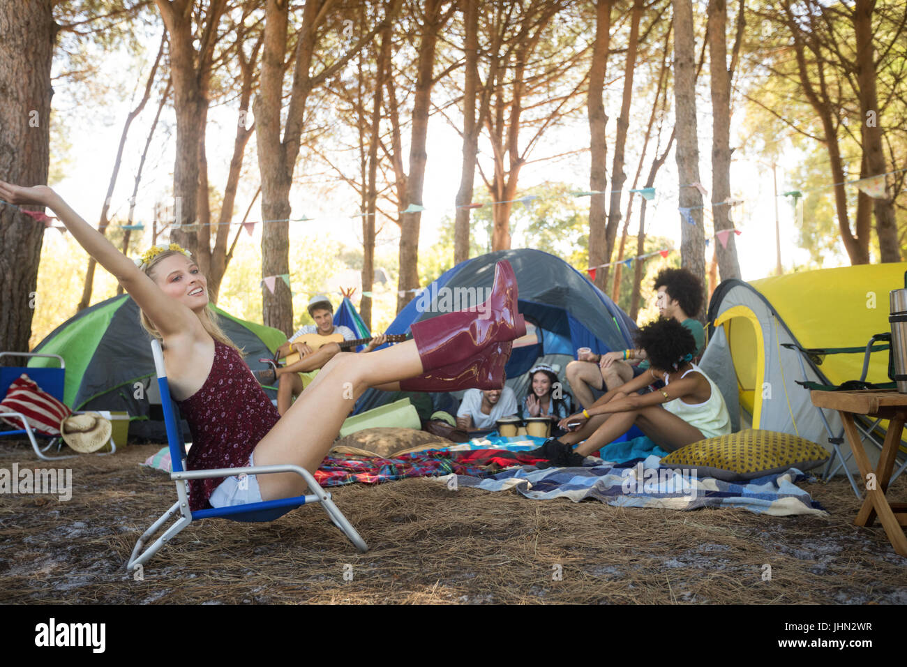 Woman sitting camping chair hi-res stock photography and images - Alamy