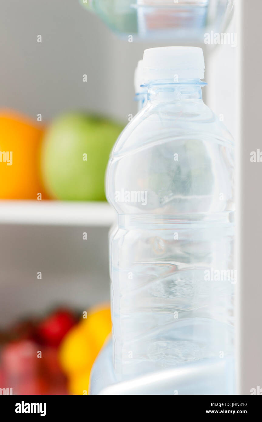 mini fridge full of bottled water isolated on white Stock Photo - Alamy