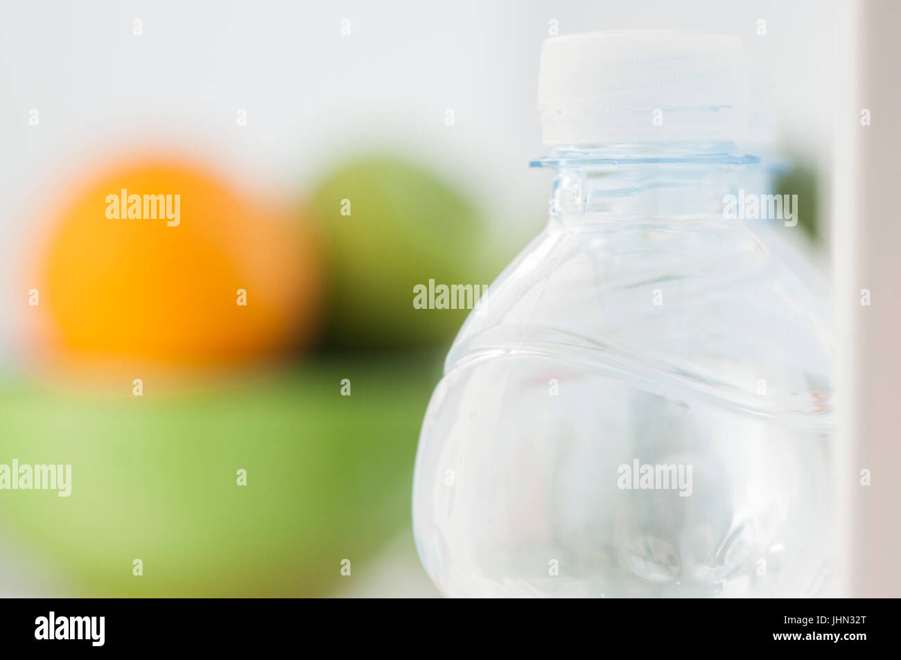 Bottles of cold and refreshing mineral water in refrigerator Stock Photo