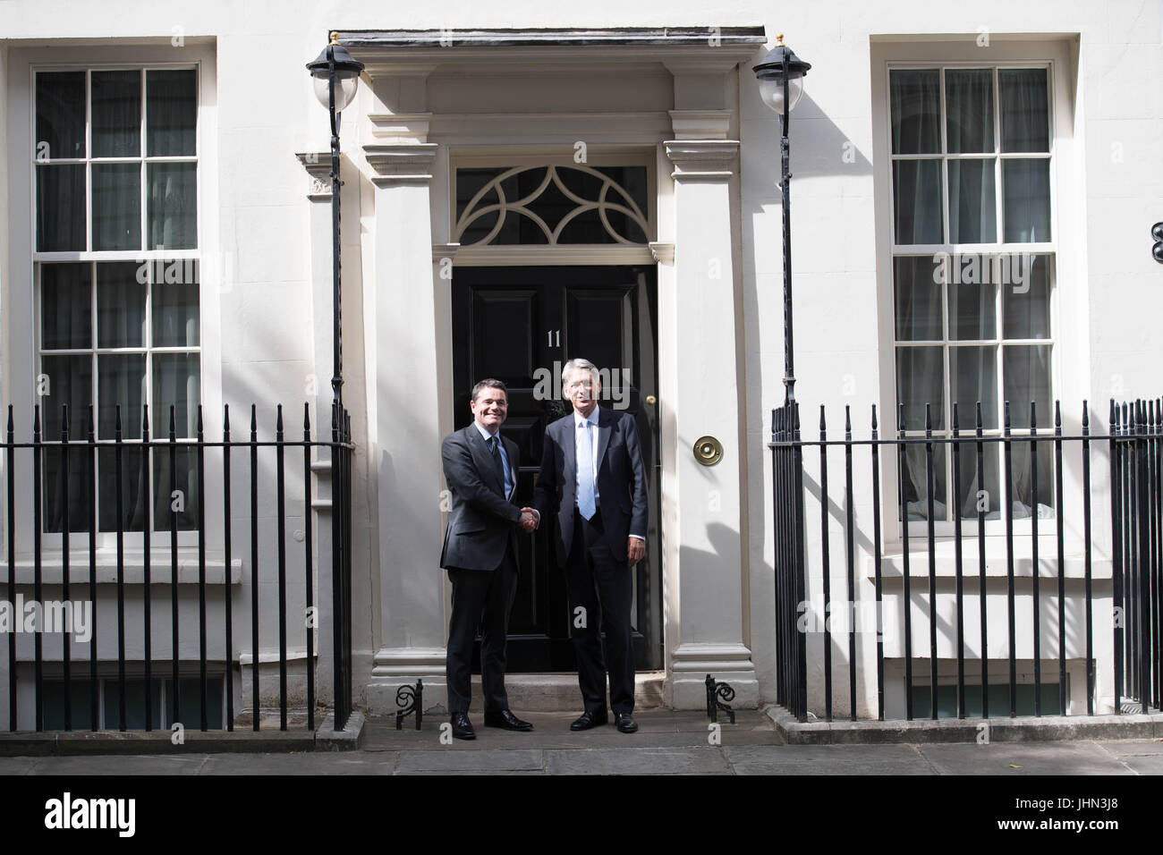 Chancellor Philip Hammond (right) greets Irish Finance Minister Paschal Donohoe outside 11 Downing Street, London, ahead of talks. Stock Photo