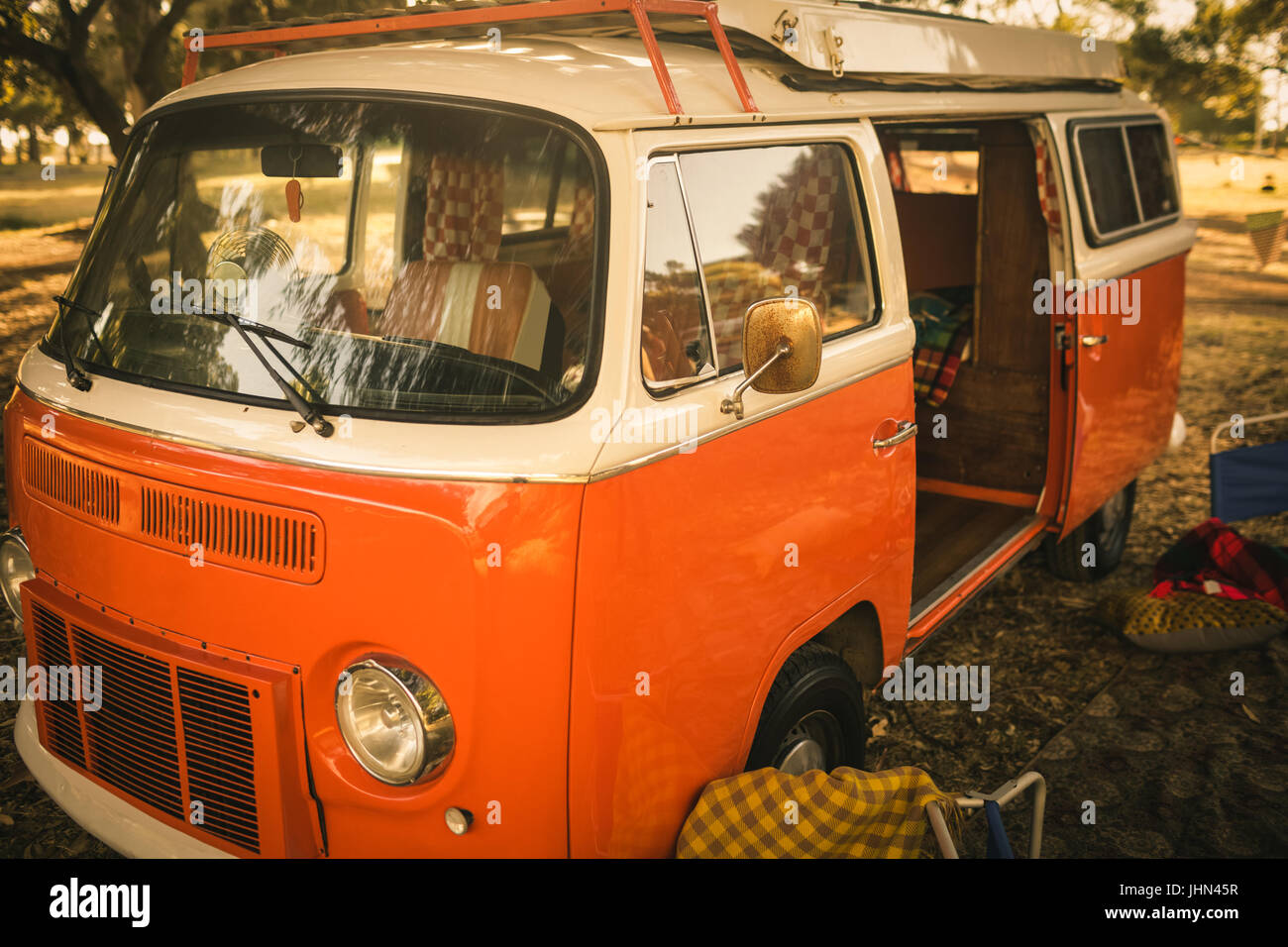Camper van parked on field at campsite Stock Photo - Alamy