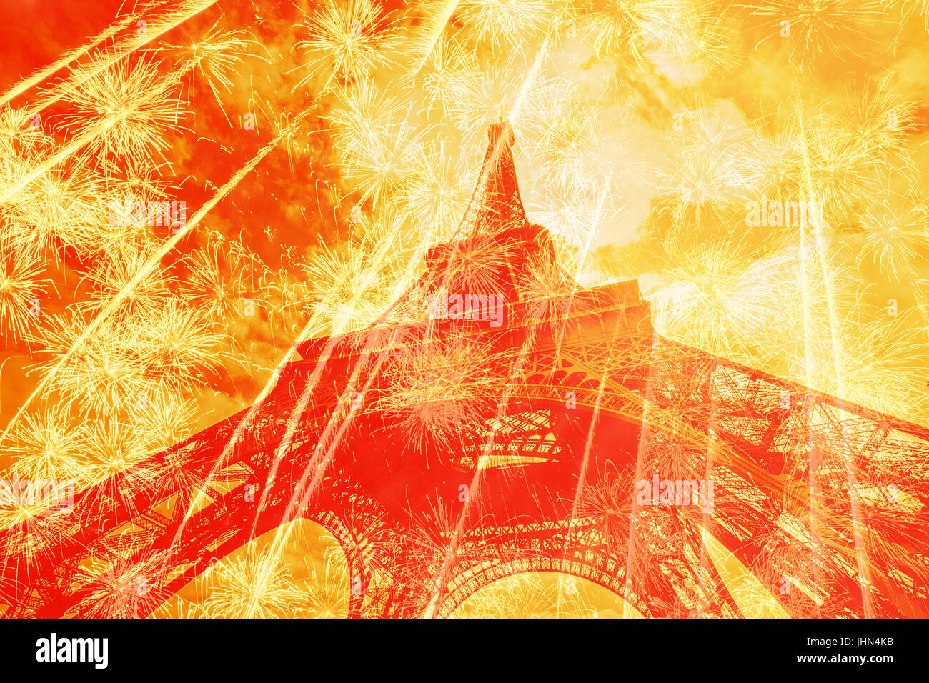Eiffel tower against bright  holiday fireworks Stock Photo