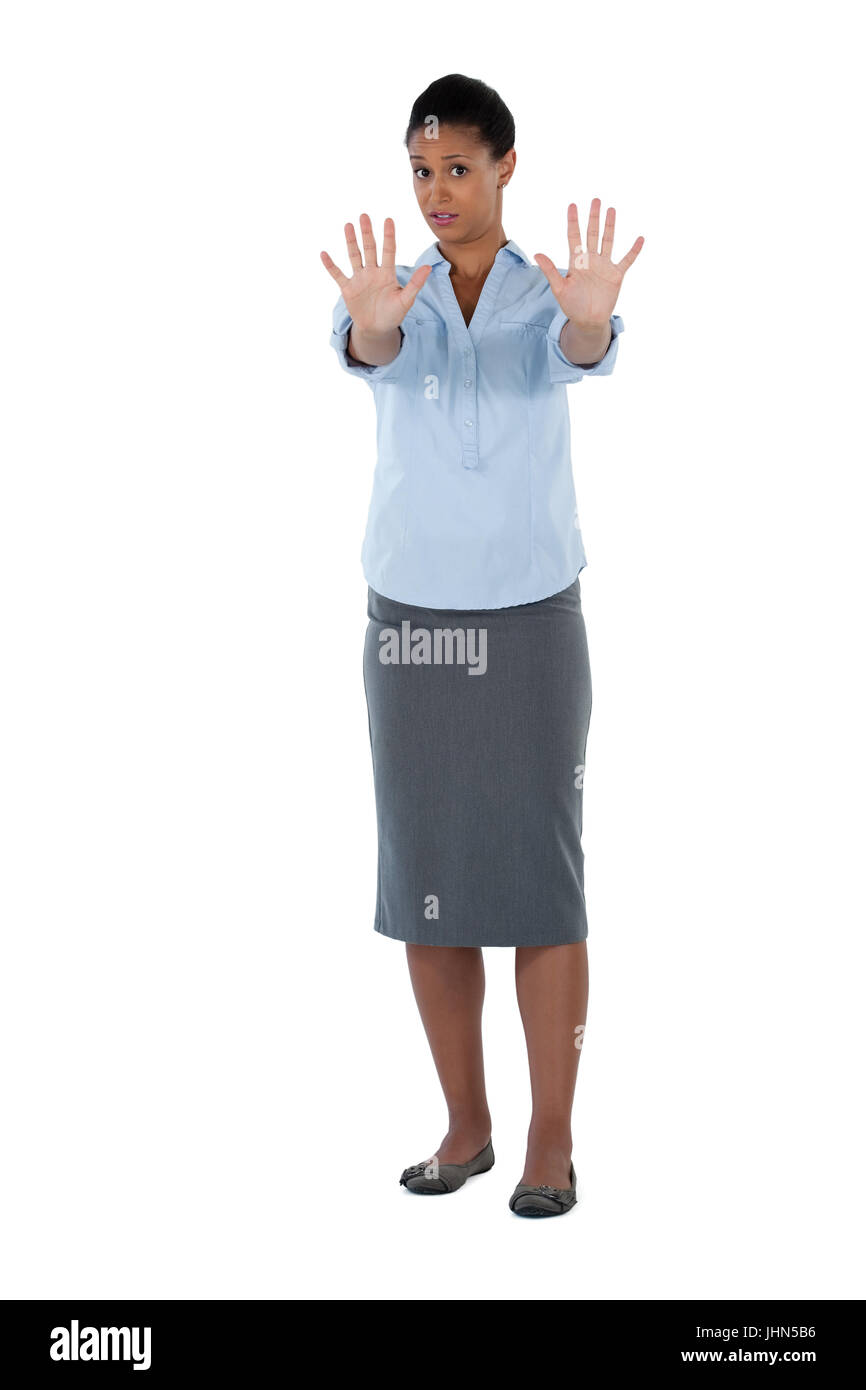 Portrait of businesswoman showing her hand while ignoring Stock Photo ...
