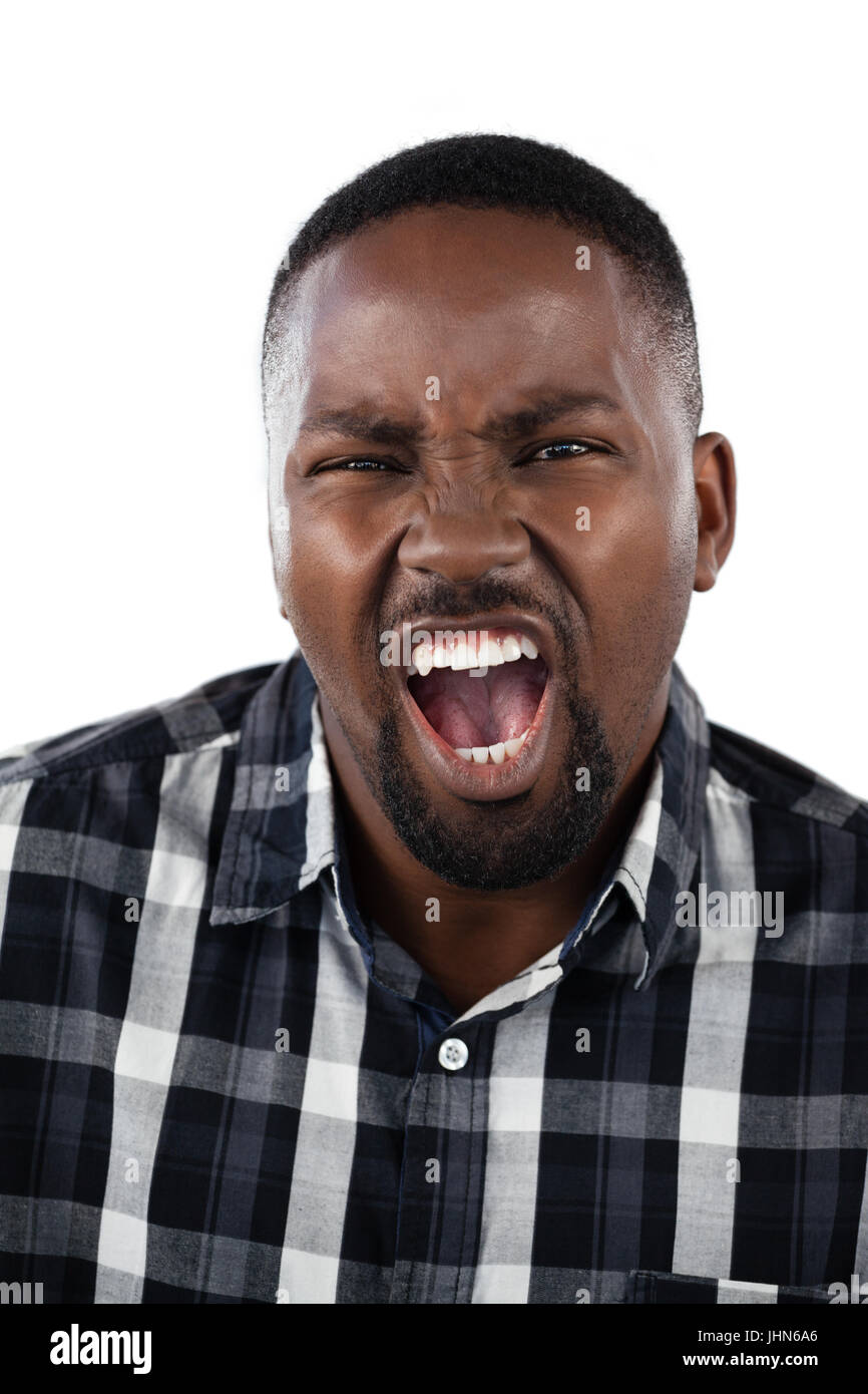 Portrait of confused man against white background Stock Photo - Alamy