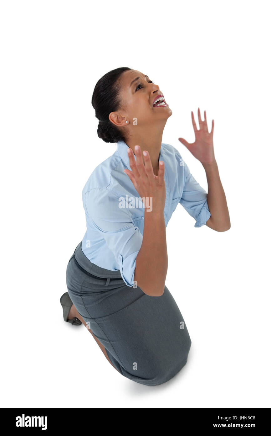 Worried businesswoman crying against white background Stock Photo