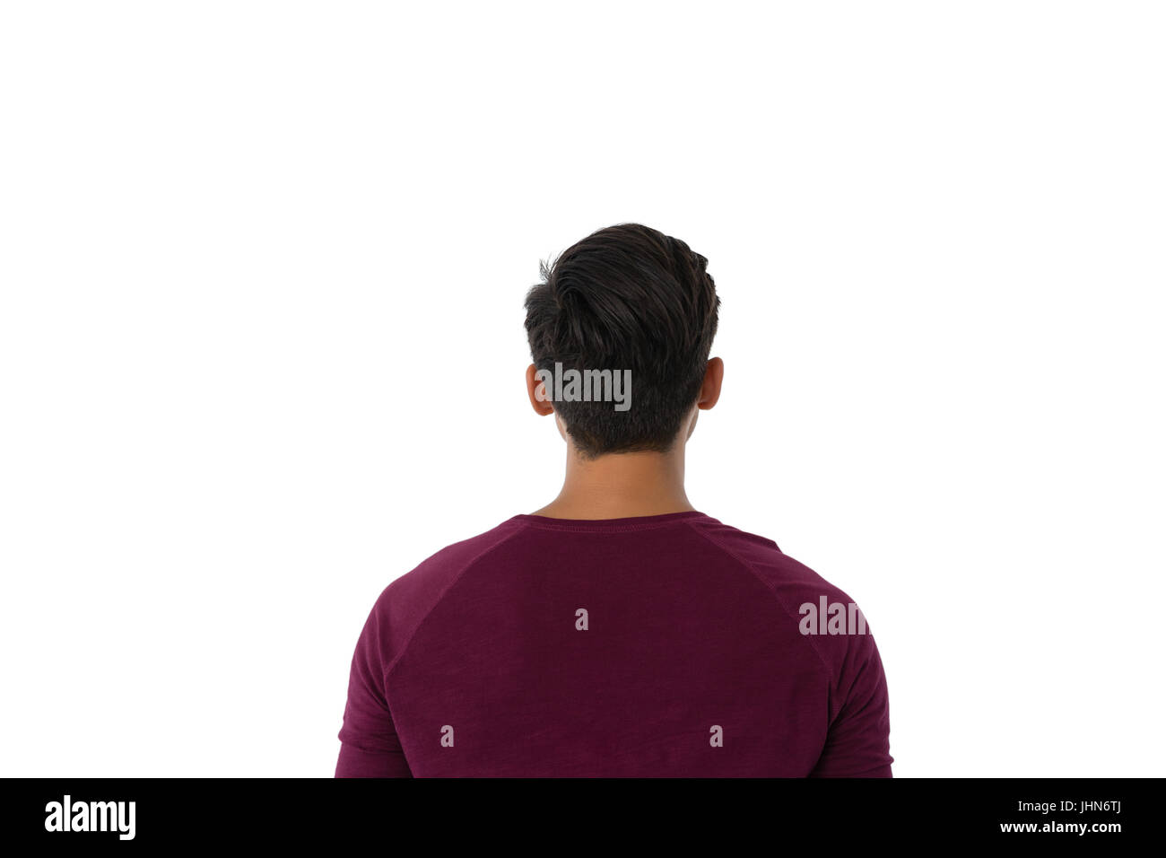 Rear view of man standing against white background Stock Photo - Alamy