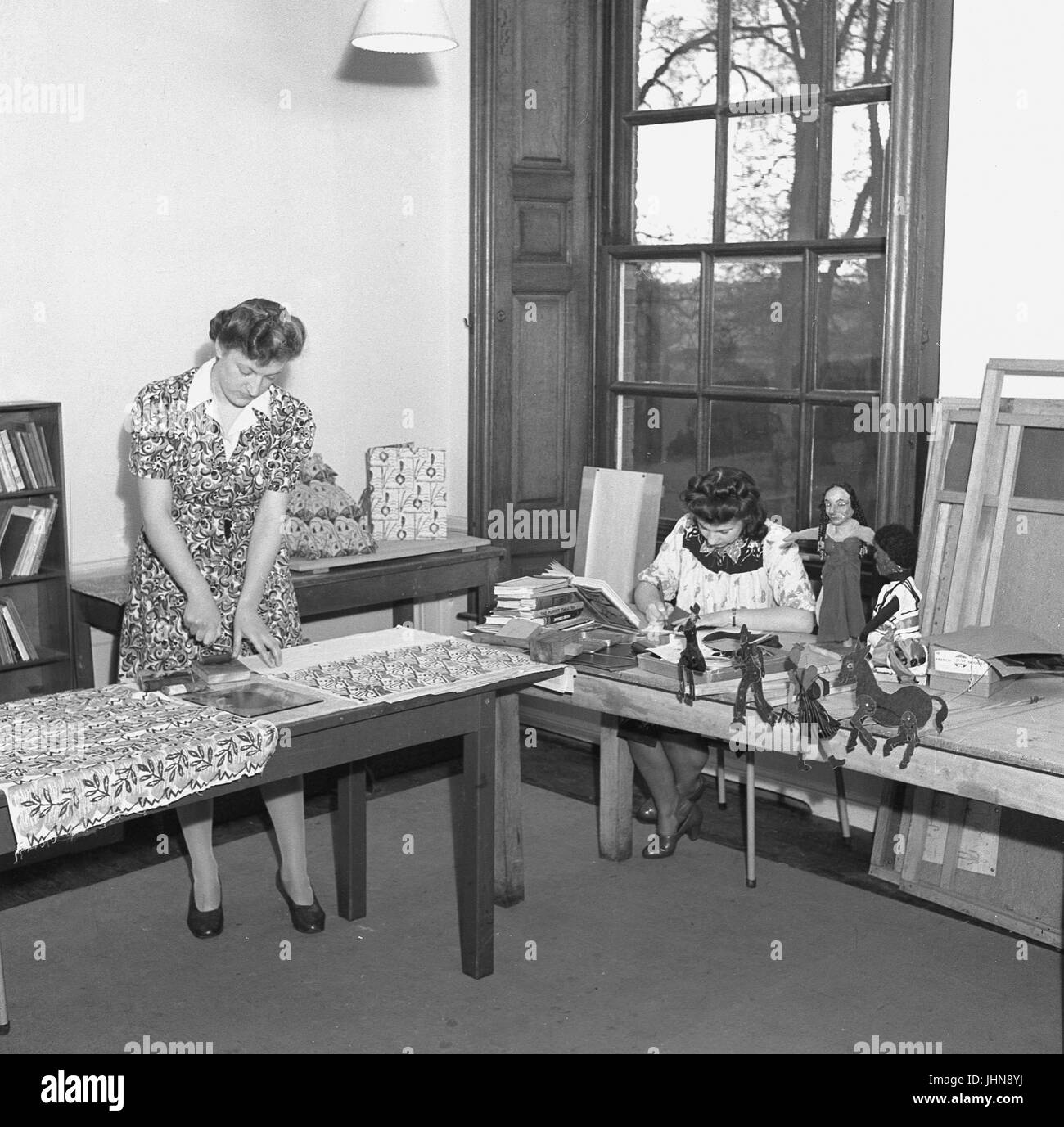 1950s, historical, two females at a teachers training college producing prints, models and other artworks as part of their course, England, UK. Stock Photo