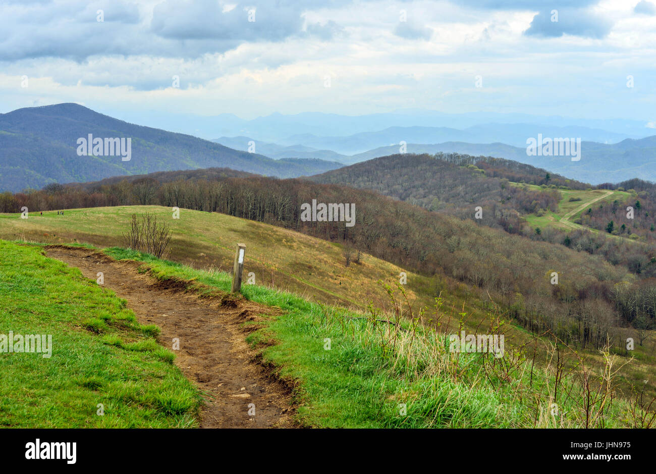 Appalachian Hiking trail crossing over Max Patch with the Appalachian Mountains in the distance. Stock Photo