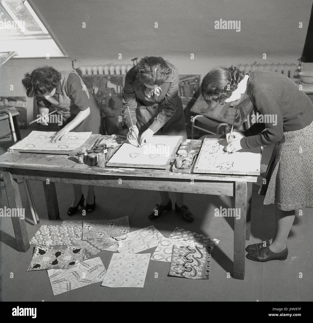 1950s, historical, England, three female students producing work for an art course at a teacher training college. Stock Photo
