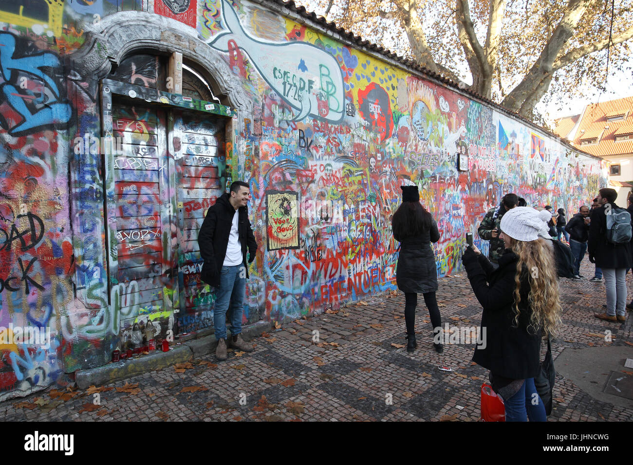 The John Lennon wall is graffiti filled wall in Prague, the Czech Republic. the wall represents a symbol of global ideals such as love and peace. Stock Photo