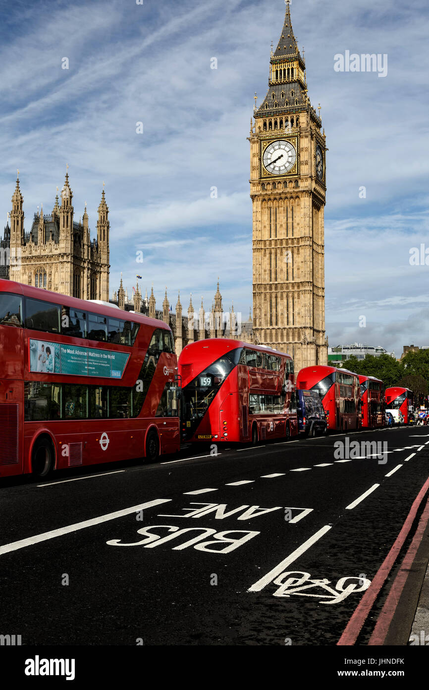 Big Ben and red double-decker buses on Westminster Bridge, London, England, United Kingdom Stock Photo