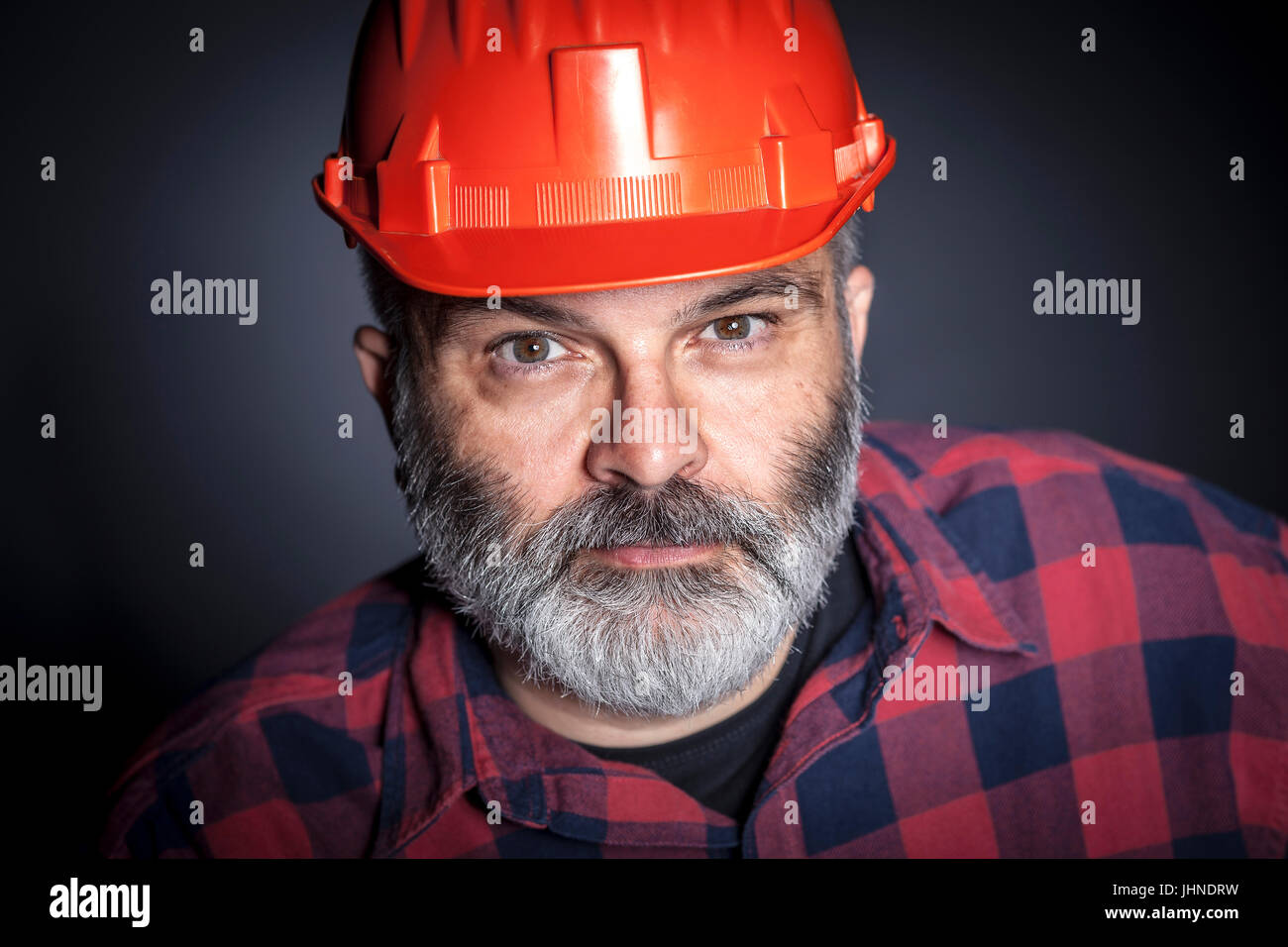 portrait of constructor with beard studio shot Stock Photo