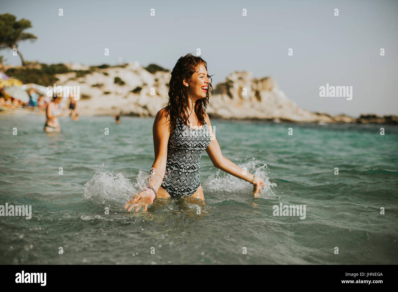 View at woman standing in the sea water Stock Photo