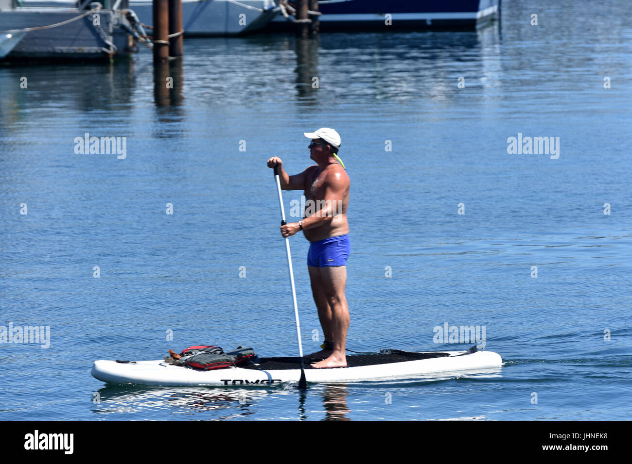 Paddleboarding in Provincetown Harbor, Massachusetts on Cape Cod Stock Photo