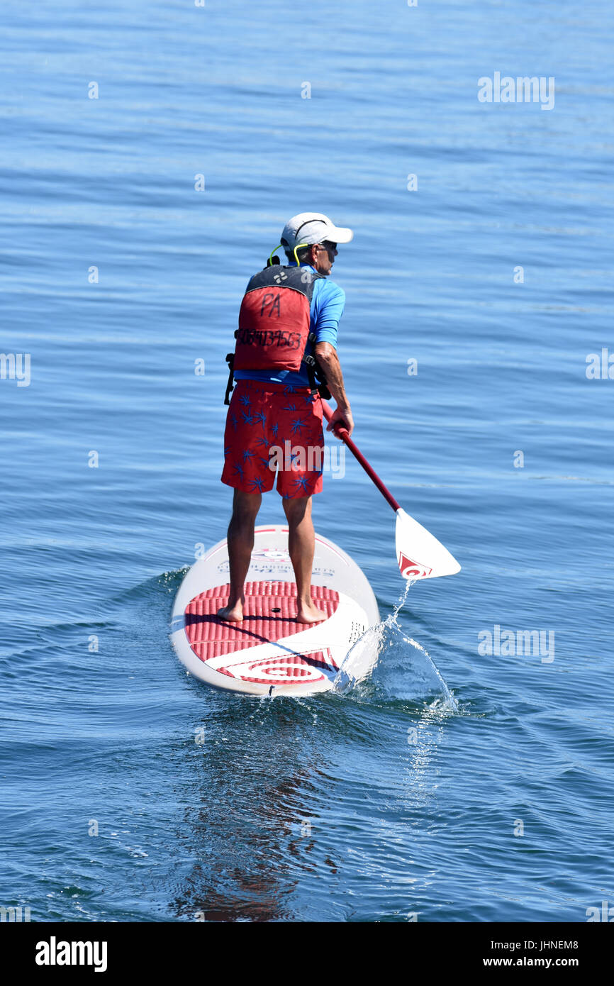 Paddleboarding in Provincetown Harbor, Massachusetts on Cape Cod Stock Photo