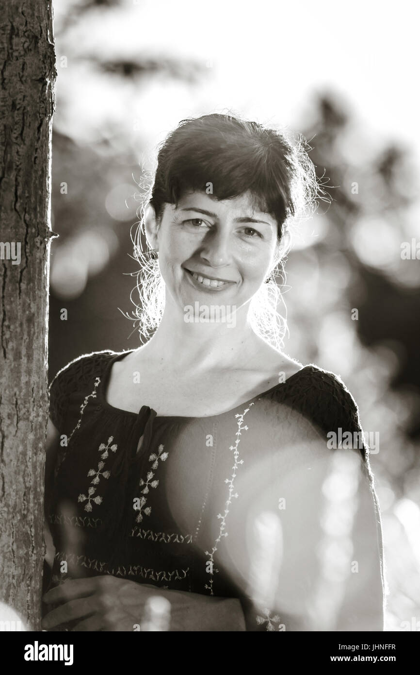 Beauty woman portrait in the summer forest, sunset Stock Photo - Alamy