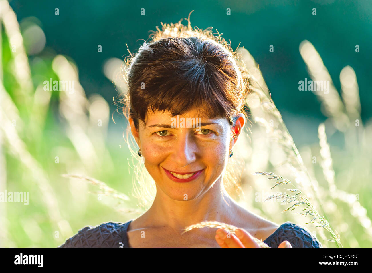 Beauty woman portrait in the summer forest, sunset Stock Photo - Alamy
