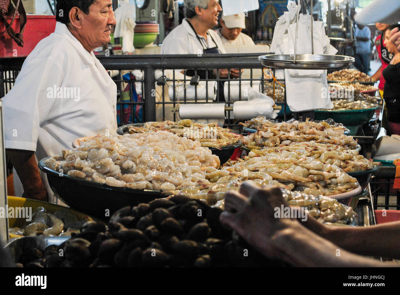 Sellers of the seafood stalls. Municipal market. Guayaquil, Ecuador Stock Photo