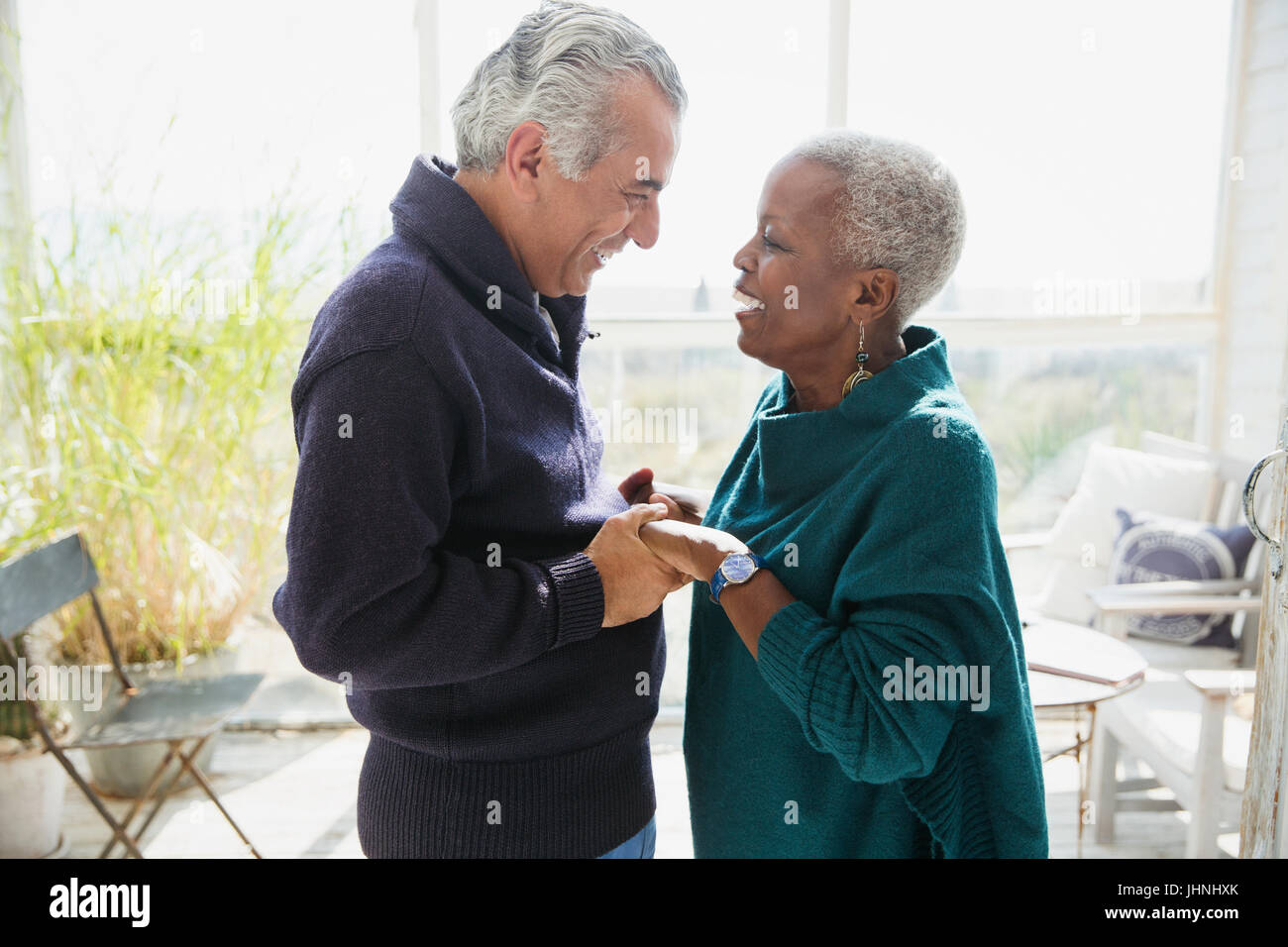 Affectionate couple holding hands face to face Stock Photo