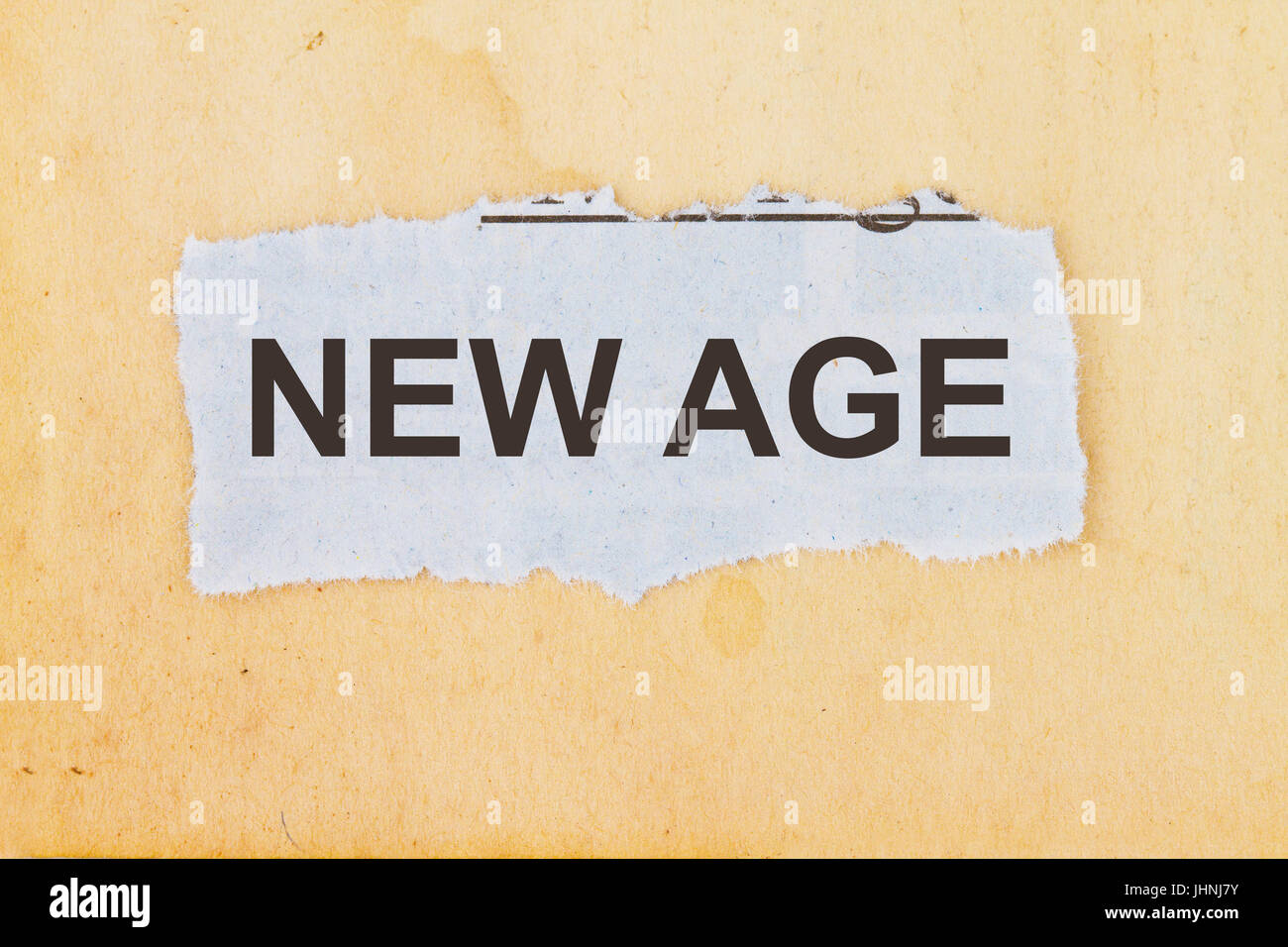 New age newspaper cutout in an old paper background Stock Photo Alamy