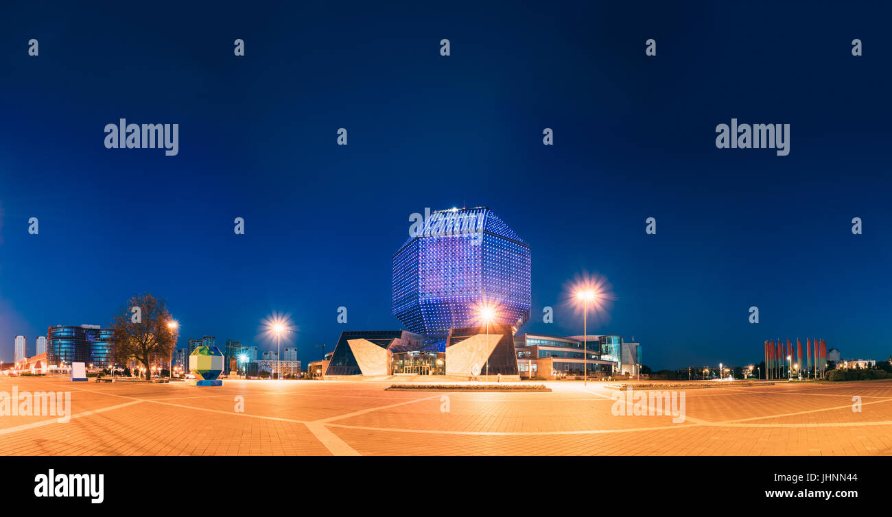 Minsk, Belarus. The View Of Deserted Pedestrian Zone To National Library Building In Evening LED Illumination Blue Sky Background. Famous Hi-Tech Land Stock Photo