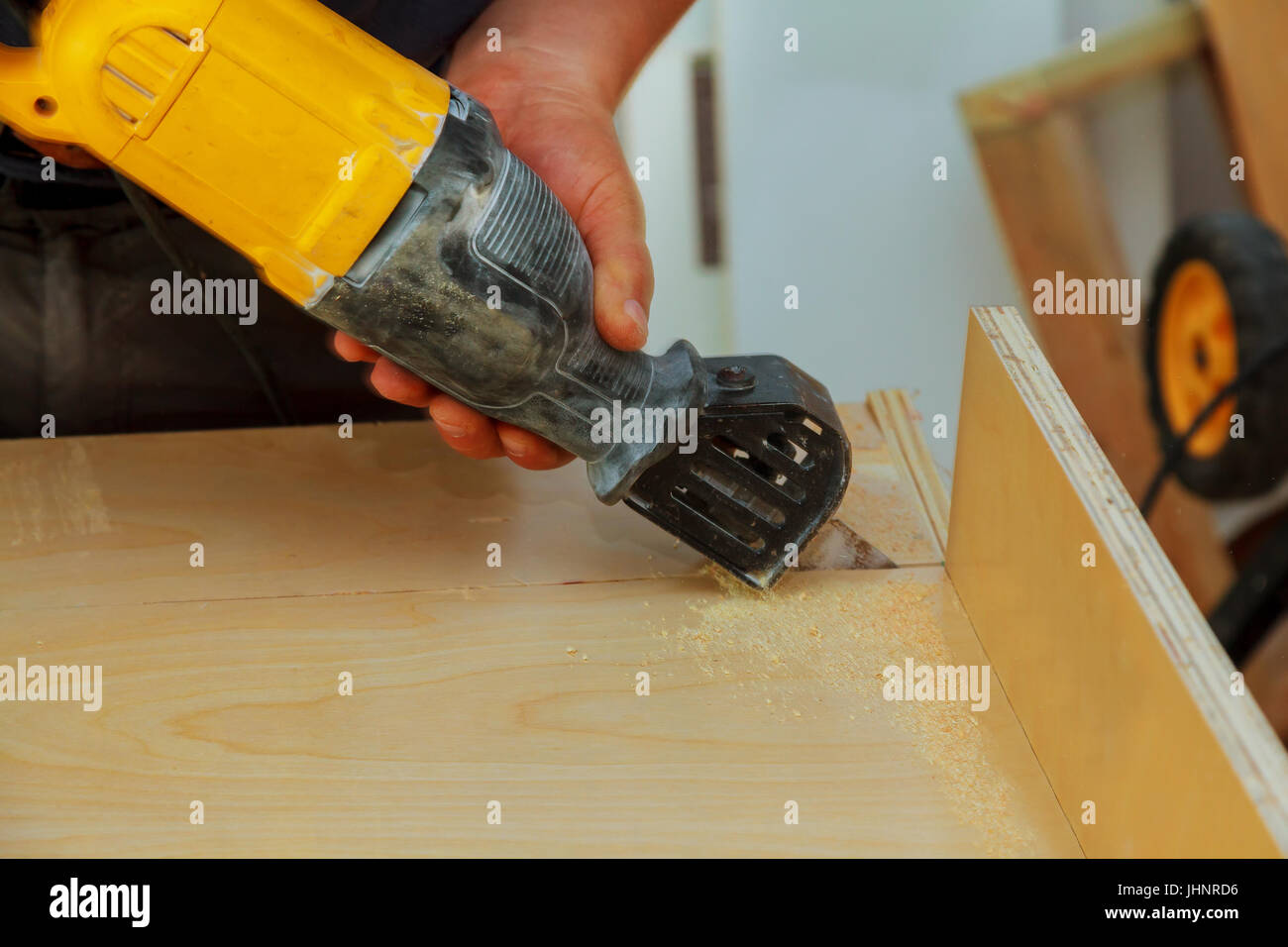 Electric powered jig saw blade adjustment, close up electric jig saw to