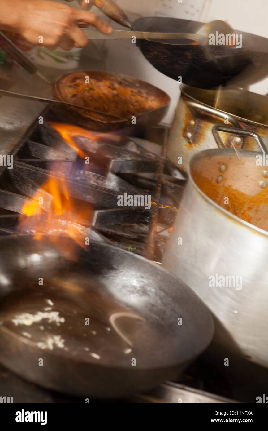 Staff prepare, cook and serve a range of English and Bengali meals at Shazanz Kebab House in