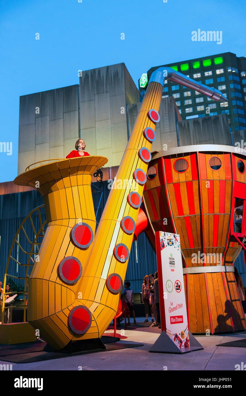 Canada,Quebec, Montreal, Montreal Jazz Festival, Place Des Festival ,childresn play station with oversize musical instruments Stock Photo