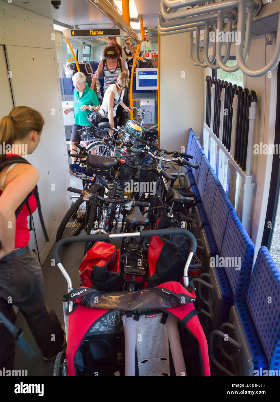 Bicycles And Pushchair On Floor In Multi Purpose Space On German